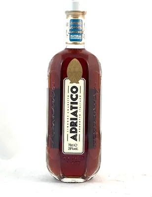 A bottle of Adriatico Amaretto Roasted Almonds liqueur.