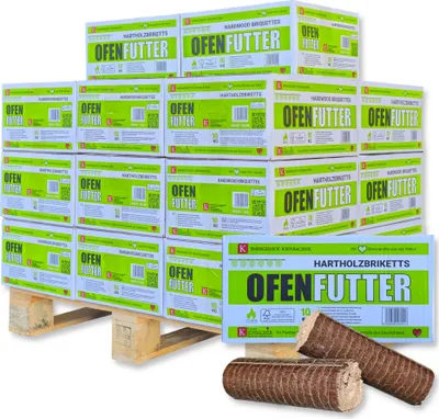 A pallet stacked with boxes of wood briquettes, with two briquettes in the foreground.