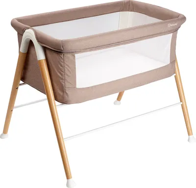 A baby bedside crib on a white background.
