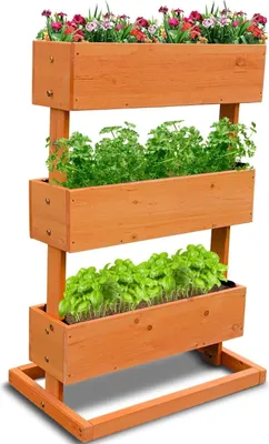 A vertical planter with three tiers filled with plants and flowers, set against a white background.
