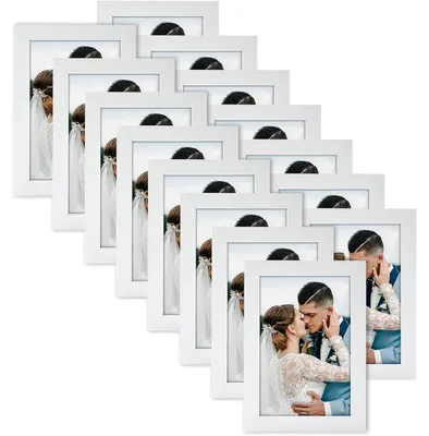 Immagine prodotto di Set di 15 cornici per foto, dimensioni 10x15 cm, colore bianco, realizzate in MDF, adatte per essere appese al muro o posizionate su un tavolo