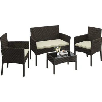 A polyrattan garden furniture set including a two-seater sofa, two armchairs, and a coffee table, all with beige cushions.