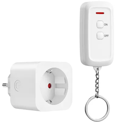 A white electrical outlet adapter and a white remote control are shown against a white background.