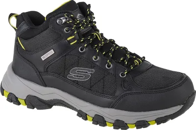 A single black and gray hiking boot with yellow accents is shown against a white background.