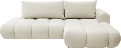 A cream-colored sectional sofa with a textured chenille fabric.