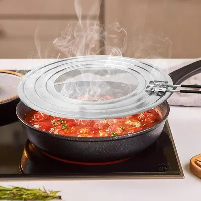 Image de Spatule universelle pour poêles, Ø 20-28 cm, noire, en acier inoxydable, avec manche