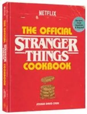 A cookbook with a red cover featuring the Stranger Things logo and images of cookies.