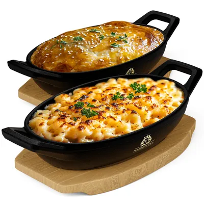 Produktbild von KAISERTAL Servierpfanne Gusseisen 15x10 cm – Pfanne mit 2 Griffen & Holzuntersetzer – Servierpfanne Klein Induktion (Oval 2 Stück)
