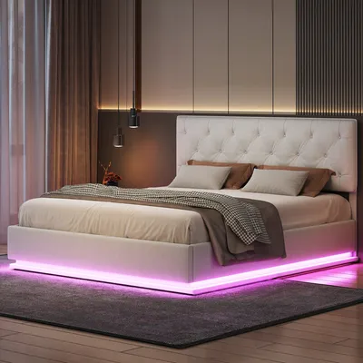 A modern bedroom with a bed featuring LED lighting.
