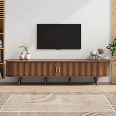 A modern living room setup with a TV stand and a television.