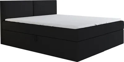 A black boxspring bed with a white mattress and a black headboard is shown against a white background.