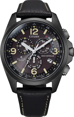 A close-up studio shot of a men's Citizen Eco-Drive watch with a black case, brown dial, and black leather strap.
