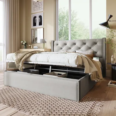 A bedroom scene with a bed as the focal point, featuring storage underneath and a tufted headboard.