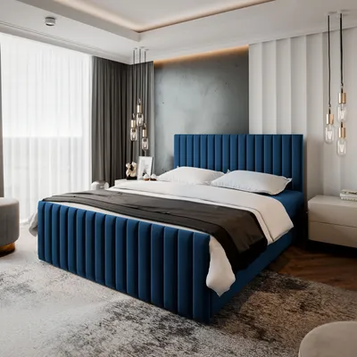 A bedroom scene featuring a blue upholstered bed.