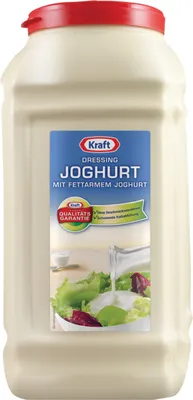 A large plastic bottle of Kraft Joghurt Dressing with a red lid, set against a white background. The label features the Kraft logo, product name, and an image of salad being dressed.