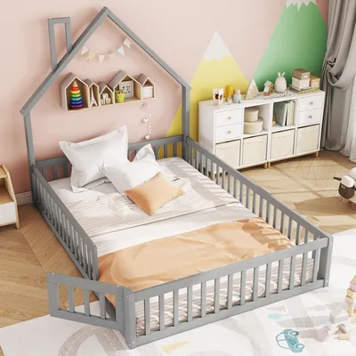 A child's bedroom with a house-shaped bed, shelves, and storage units.