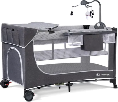 A grey Kinderkraft LEODY travel cot with accessories, including a changing station and mobile, is shown against a white background.