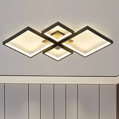 A modern ceiling light fixture with a geometric design, mounted on a white ceiling.