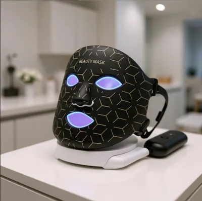 Immagine prodotto di Maschera LED per il viso in silicone Photon a 7 colori Maschera di bellezza 3D per il viso Terapia con luce rossa Cura della pelle Riparazione Schiarimento della pelle Utilizzo senza fili