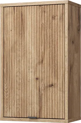 A close-up view of a wooden cabinet door with vertical grooves.