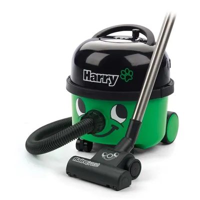 A green and black vacuum cleaner with a smiling face, on a white background.