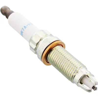 A close-up studio shot of a single spark plug against a white background.