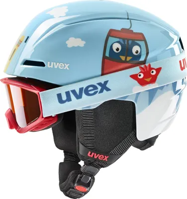 A children's ski helmet with goggles attached, featuring a cartoon bird design.