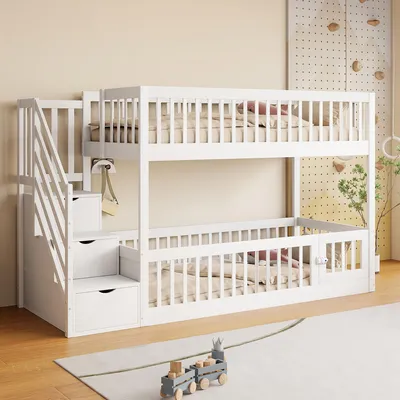 A white wooden bunk bed with stairs and storage drawers in a child's room.
