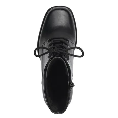 A top-down view of a black lace-up boot.