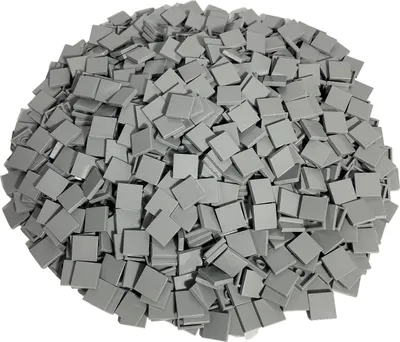 A pile of small, square, light gray LEGO tiles.