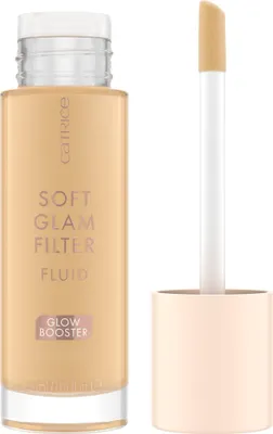 A bottle of Catrice Soft Glam Filter Fluid Glow Booster with its applicator wand next to it.