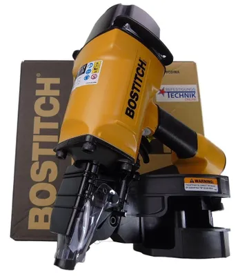 A yellow and black Bostitch nail gun is shown in front of its packaging box.