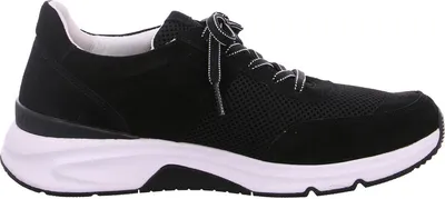 A side view of a black women's sneaker with a white sole.