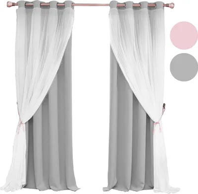 A pair of gray curtains with white sheer overlays, tied back with pink ribbons, displayed on a curtain rod against a white background. Two colored circles, pink and gray, are visible on the right side.