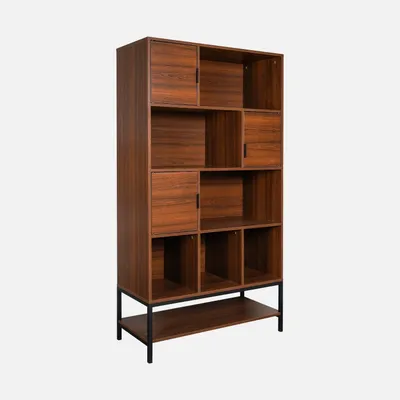 A tall, narrow bookshelf with multiple compartments and a dark wood finish, standing on a black metal frame.