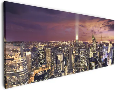 Produktbild von Wallario Premium Leinwandbild New York bei Nacht - Panoramablick über die Stadt in Größe 60 x 150 cm
