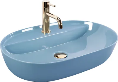 A light blue oval sink with a gold faucet and drain.