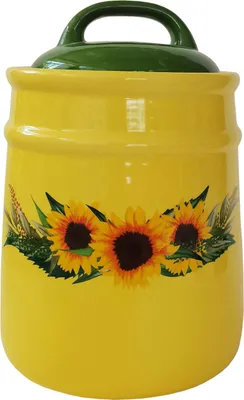 A yellow ceramic jar with a green lid and a sunflower design.