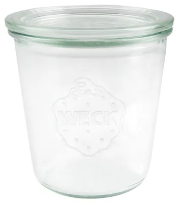 A clear glass jar with a lid, embossed with the brand name.