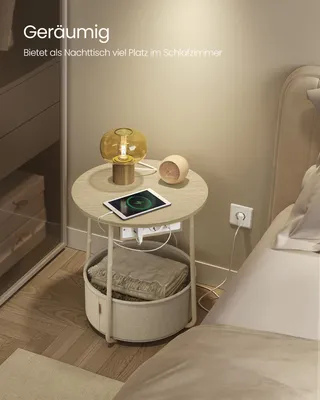 A bedside table with a lamp, tablet, and storage basket in a bedroom setting.
