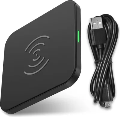 A black wireless charging pad and a black USB cable are shown against a white background.