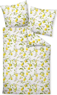 A flat lay of a bedding set with a lemon pattern.