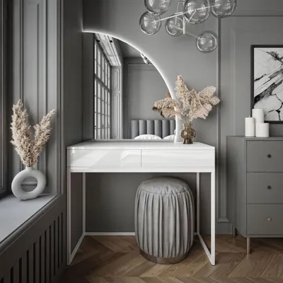 A modern vanity table with a LED mirror, stool, and decorative elements in a stylish room.