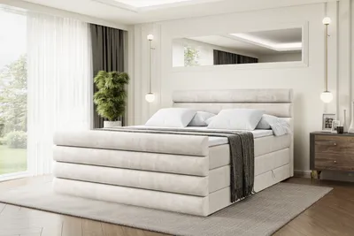 A bedroom scene featuring a large bed.