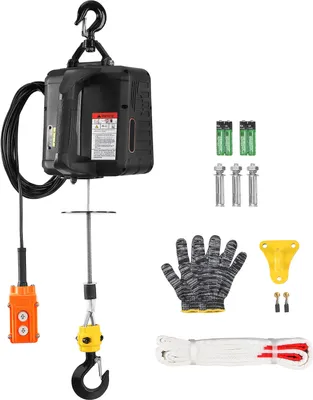 A black electric hoist with an orange remote control and various accessories, including batteries, gloves, and mounting hardware, are displayed against a white background.