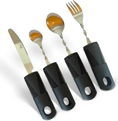 Four adaptive eating utensils with thick black handles and twisted metal shafts, arranged diagonally on a white background.