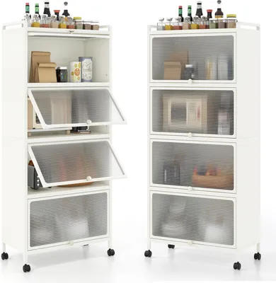 Two white metal kitchen storage shelves with clear ribbed doors are shown side-by-side against a white background. The shelves are filled with various kitchen items.
