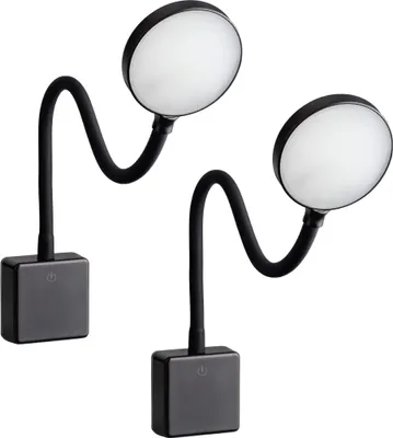 Two black LED plug-in lamps with flexible necks and round light heads are shown against a white background.