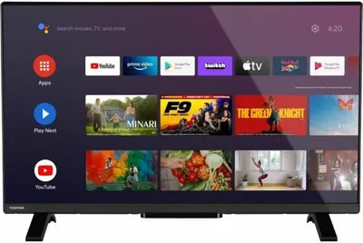 A Toshiba smart TV displaying its home screen with various apps and movie posters.