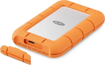 A LaCie Rugged Mini SSD external hard drive is shown on a white background. A protective orange bumper surrounds the silver drive, and a small orange cap is detached from the front.